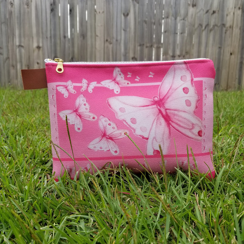 From art supplies to keepsakes, baby necessities, travel gear, or gadget cases, this Goddess Pink Pouch is amazing!  Vibrant print, durable canvas shell, and denim lining. Beautiful watercolor pink butterflies. - Denim Lined - 100% polyester textured canvas - Metal zipper - Size 10 inches