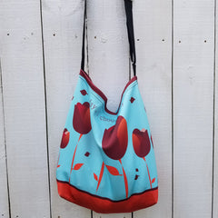 Beautiful neutral brown color with a vibrant turquoise color. With an adjustable strap for comfort, our Redblossom Tulip Tote is made from soft neoprene that stretches to fit whatever you can throw at, or in it! Beautiful design outside and inside. Perfect for the beach too! -Tote made from a soft, supple double knit neoprene fabric, 92% polyester, 8% spandex. - Easy adjustable 44