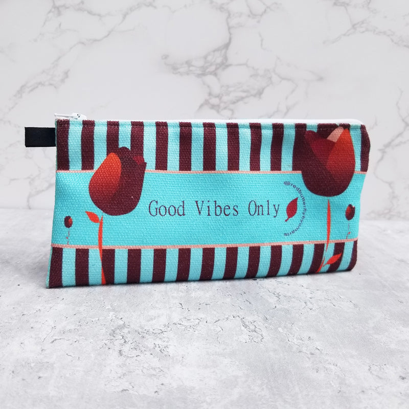 Art and versatility in one small case! Functional and decorative, this Redblossom Pencil Case is the perfect choice for your small goodies that sometimes you have misplaced inside your bag. -100% polyester textured canvas - Size 9" by 4" inches - Exclusive design by RedButterfly by Omaris  