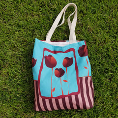 With room for notebooks and a laptop, Reblossom Tote can be so versatile!  A beautiful combination of blue color, stripes, and tulips. - 100% polyester textured canvas withstands everyday use while looking great - Unique design that will never fade. - Cotton webbed 1