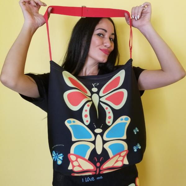 Butterflylove Tote is the perfect size for carrying a change of clothes, your Butterfly Makeup Bag, and why not? Your favorite book! . Tote made from a soft, supple double knit neoprene fabric, 92% polyester, 8% spandex. Butterfly vibrant design. Easy adjustable 44" strap. by RedButterfly by Omaris