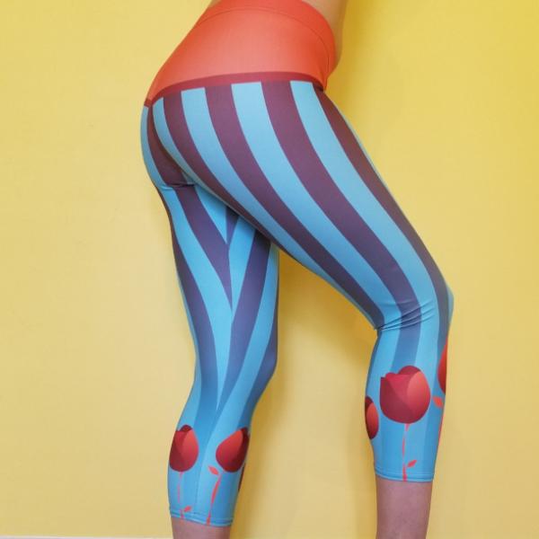 Super soft and comfortable capris, leggings.  Beautiful design with stripes, and tulips with blue and orange tones. 82% polyester/18% spandex . Material has a four-way stretch. Great for dancewear, workout, yoga pants. by RedButterfly by Omaris
