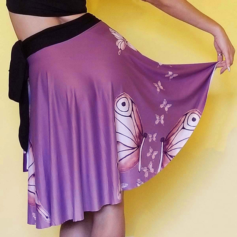 The Goddess Purple Wrap Skirt is designed to fit all the beautiful curves. Very comfy and unique style. Great for traveling.  - Medium weight soft jersey 92% polyester and 8% spandex - Available in one size - The waist tie is made from bamboo jersey fabric - Watercolor Butterflies  - Exclusive design by RedButterfly by Omaris