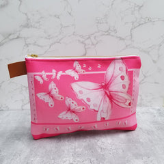 From art supplies to keepsakes, baby necessities, travel gear, or gadget cases, this Goddess Pink Pouch is amazing!  Vibrant print, durable canvas shell, and denim lining. Beautiful watercolor pink butterflies. - Denim Lined - 100% polyester textured canvas - Metal zipper - Size 10 inches