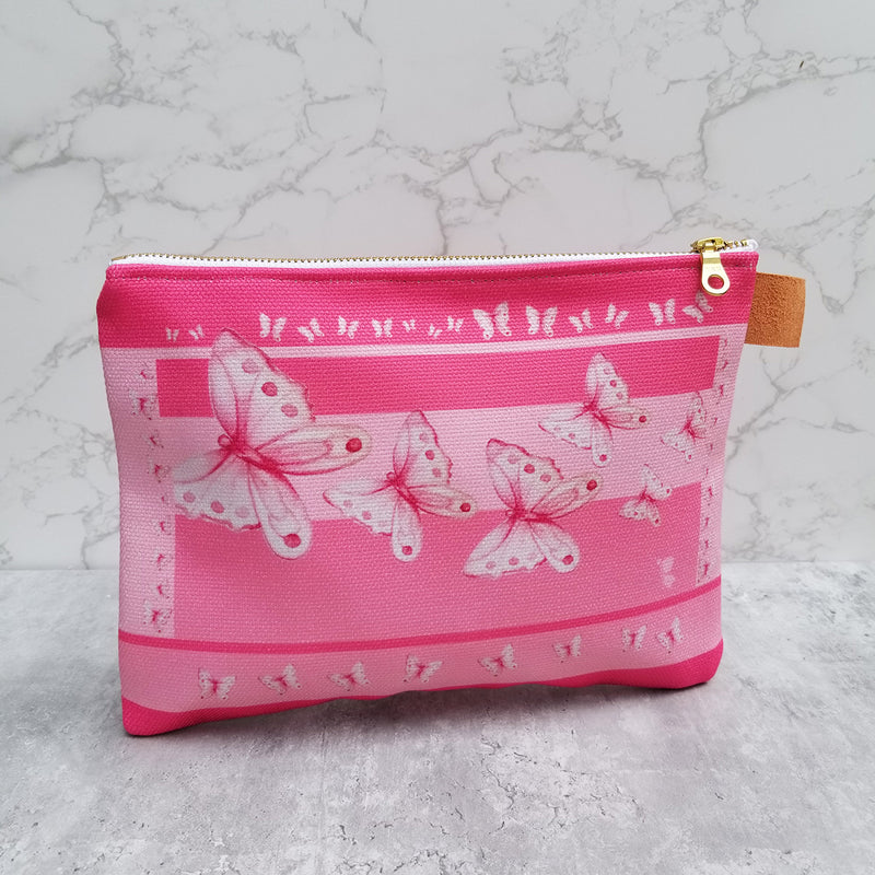 From art supplies to keepsakes, baby necessities, travel gear, or gadget cases, this Goddess Pink Pouch is amazing!  Vibrant print, durable canvas shell, and denim lining. Beautiful watercolor pink butterflies. - Denim Lined - 100% polyester textured canvas - Metal zipper - Size 10 inches