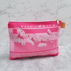 From art supplies to keepsakes, baby necessities, travel gear, or gadget cases, this Goddess Pink Pouch is amazing!  Vibrant print, durable canvas shell, and denim lining. Beautiful watercolor pink butterflies. - Denim Lined - 100% polyester textured canvas - Metal zipper - Size 10 inches