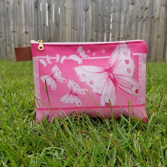 From art supplies to keepsakes, baby necessities, travel gear, or gadget cases, this Goddess Pink Pouch is amazing!  Vibrant print, durable canvas shell, and denim lining. Beautiful watercolor pink butterflies. - Denim Lined - 100% polyester textured canvas - Metal zipper - Size 10 inches