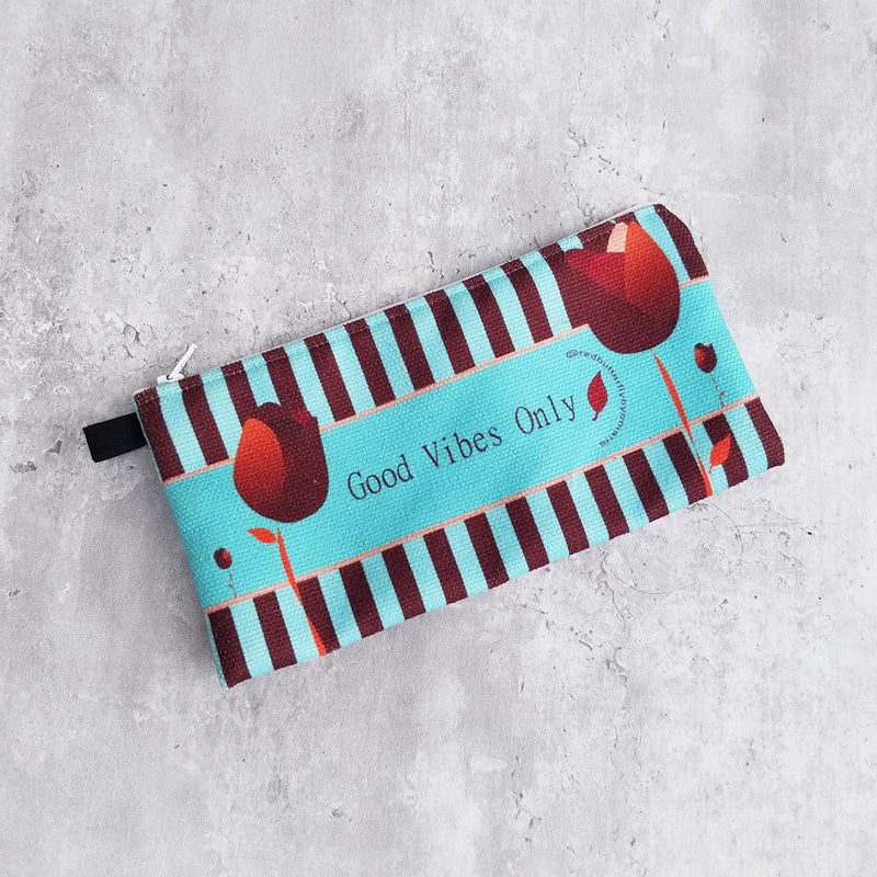 Art and versatility in one small case! Functional and decorative, this Redblossom Pencil Case is the perfect choice for your small goodies that sometimes you have misplaced inside your bag. -100% polyester textured canvas - Size 9" by 4" inches - Exclusive design by RedButterfly by Omaris  
