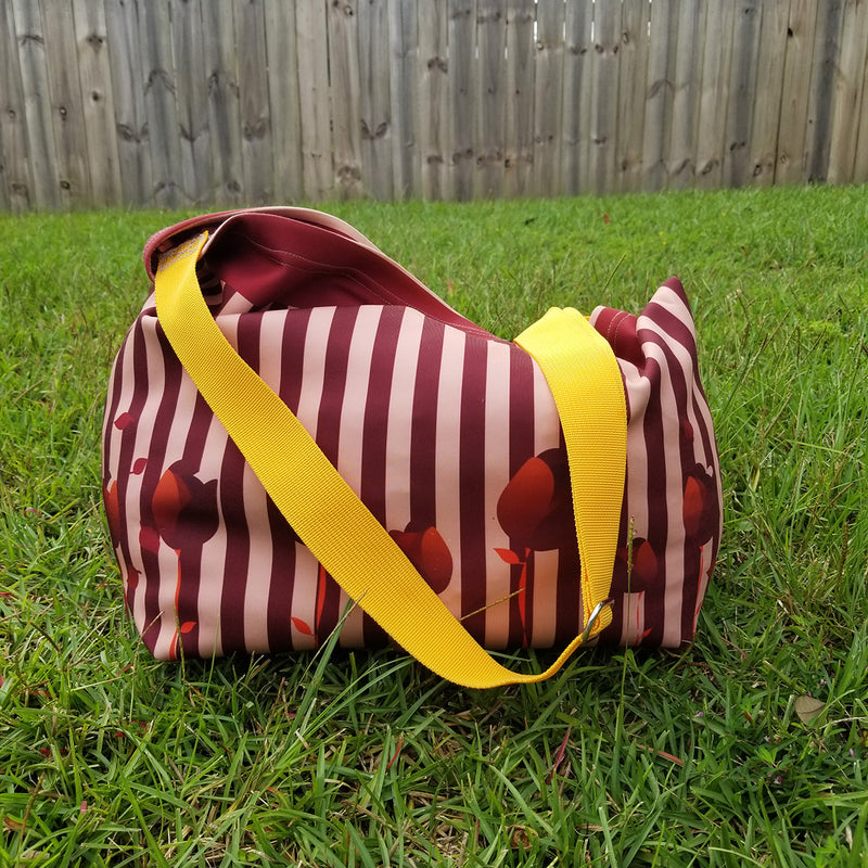 Earthy and neutral colors, perfect to match with any clothing you may have. The Reblossom Brown Tote is what you need to complete your wardrobe. Beautiful print inside for inspiration. A beautiful combination of stripes and tulips. - Made with soft neoprene fabric, 92% polyester, 8% spandex - With an easy 44" adjustable strap for comfort - Strong metal hardware and professional bar tacking - Exclusive design by RedButterfly by Omaris  