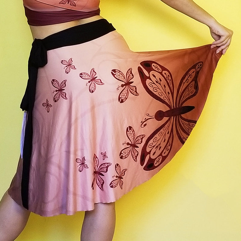  Neutral colors so you can match this beautiful wrap skirt with many other colors.  Very comfortable and with a fashionable style. - Medium weight soft jersey 92% polyester and 8% spandex - One Size - The waist tie is made with bamboo jersey fabric - Watercolor print - Exclusive design by RedButterfly by Omaris