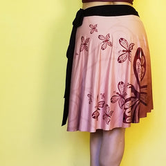  Neutral colors so you can match this beautiful wrap skirt with many other colors.  Very comfortable and with a fashionable style. - Medium weight soft jersey 92% polyester and 8% spandex - One Size - The waist tie is made with bamboo jersey fabric - Watercolor print - Exclusive design by RedButterfly by Omaris