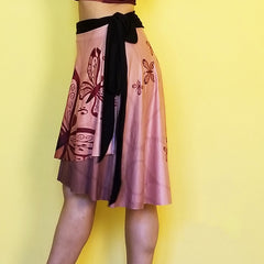  Neutral colors so you can match this beautiful wrap skirt with many other colors.  Very comfortable and with a fashionable style. - Medium weight soft jersey 92% polyester and 8% spandex - One Size - The waist tie is made with bamboo jersey fabric - Watercolor print - Exclusive design by RedButterfly by Omaris